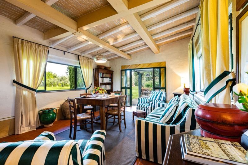 Villa al Prato's living room with striped sofas