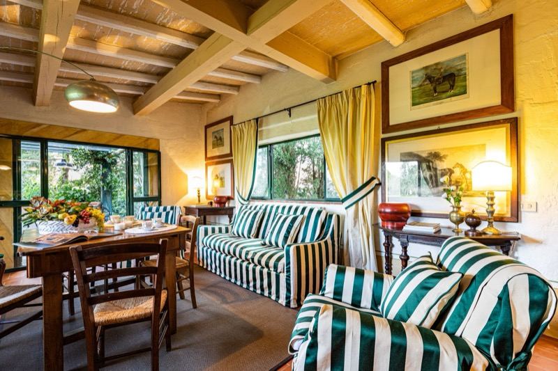 The living room with the table laid and the sofas