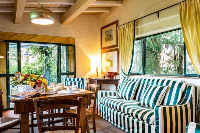 The striped sofa and the green window onto the garden