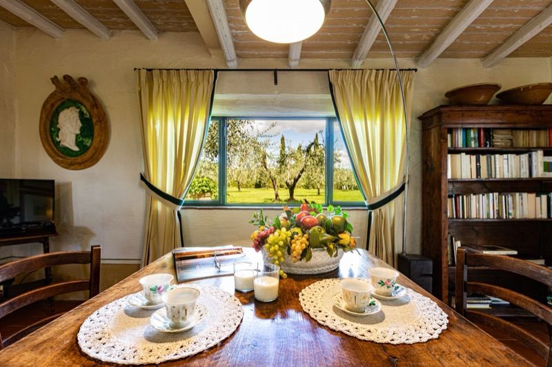 Tea on the table in front of the window onto the olives