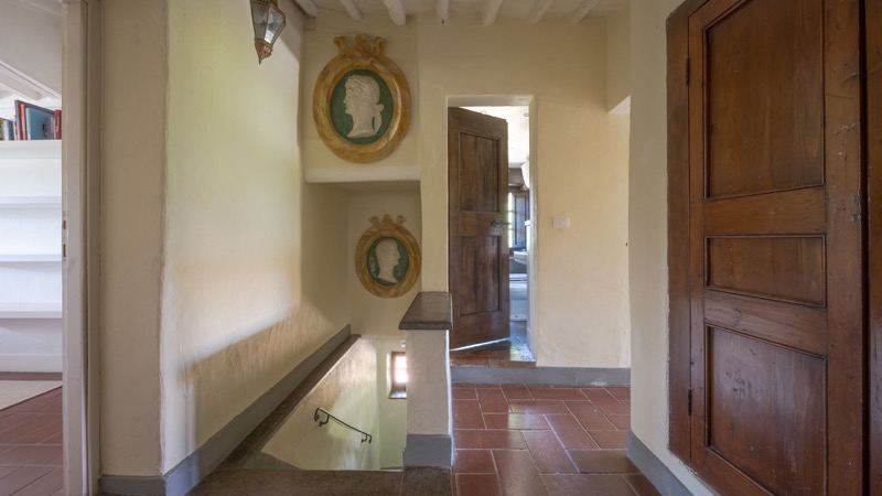 The corridor with cameos and wooden doors