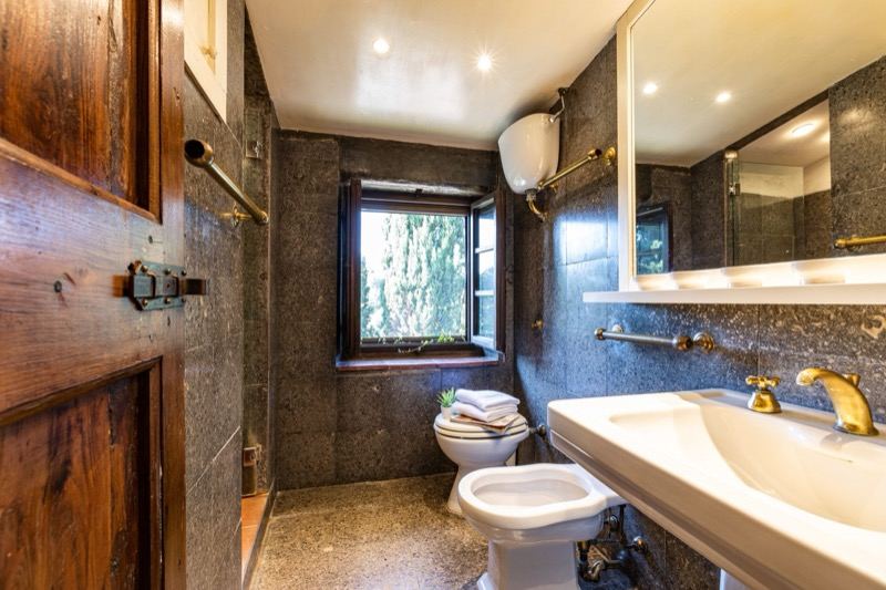 The grey stone bathroom with window