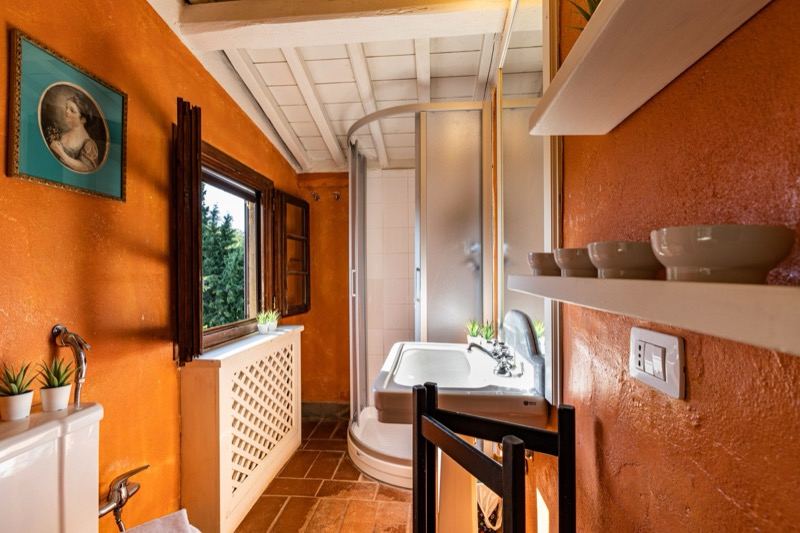 The orange bathroom with shower cubicle
