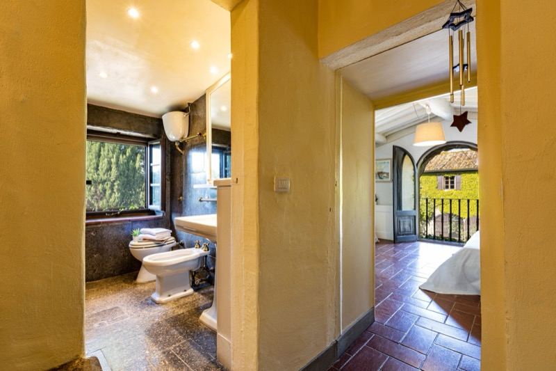 From the bathroom to the bedroom with the arched balcony