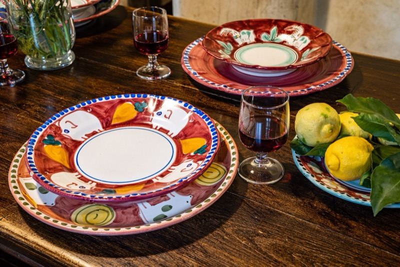 Hand-painted plates with lemons and wine