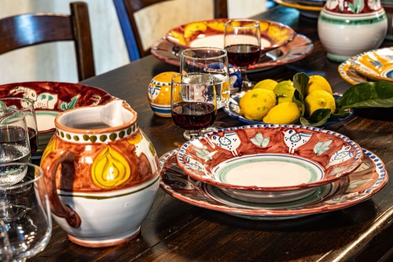 Painted jug and plates with lemons