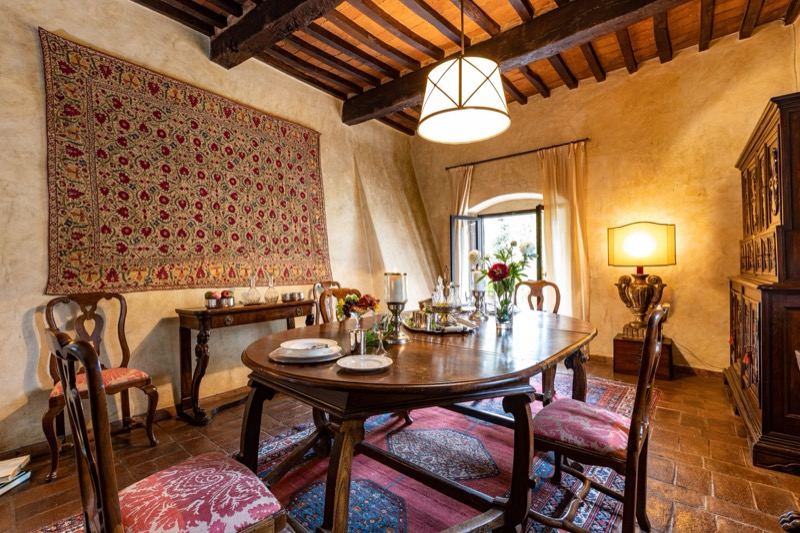 The table laid beneath the tapestry