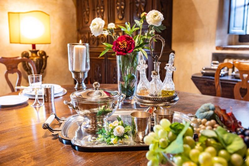 Silver, crystal and peonies on the table
