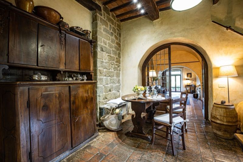 The wooden dresser and the kitchen arch