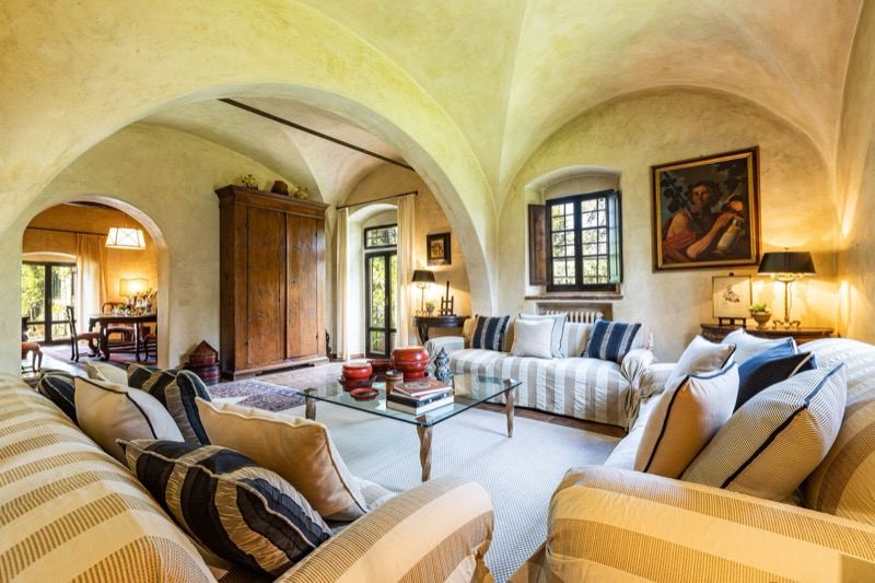 The vaulted living room seen from the fireplace side