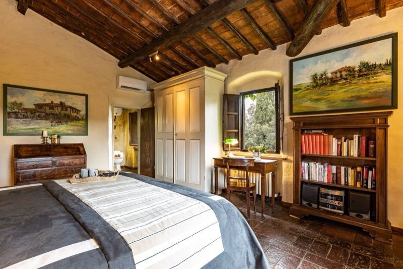 Bedroom with the white wardrobe, bookcase and beams