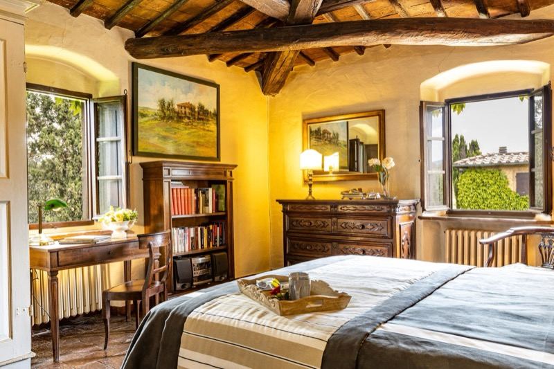 Bedroom with the desk at the window and the mirror