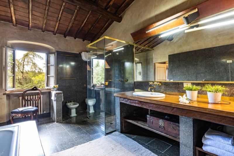 The green marble bathroom with shower and painted cabinet
