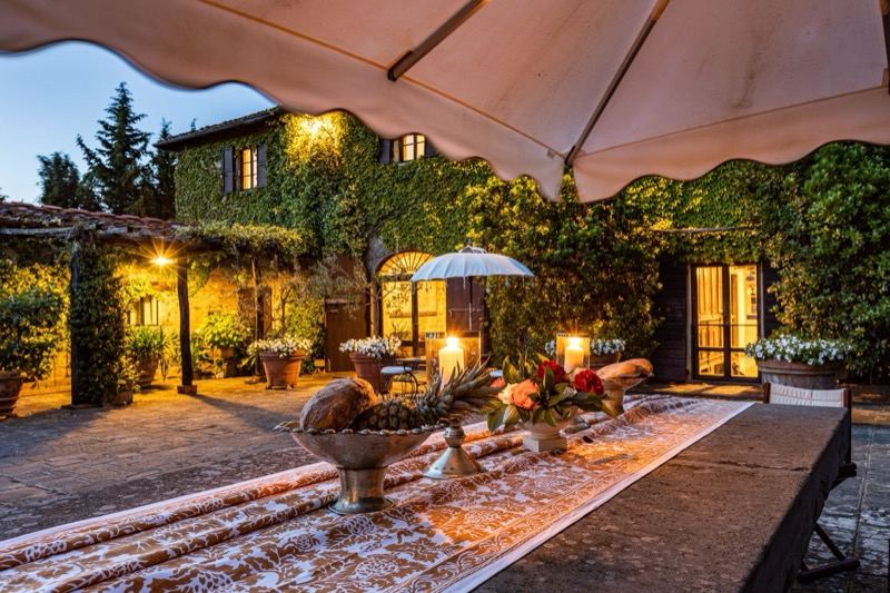 Dinner laid in the courtyard at dusk
