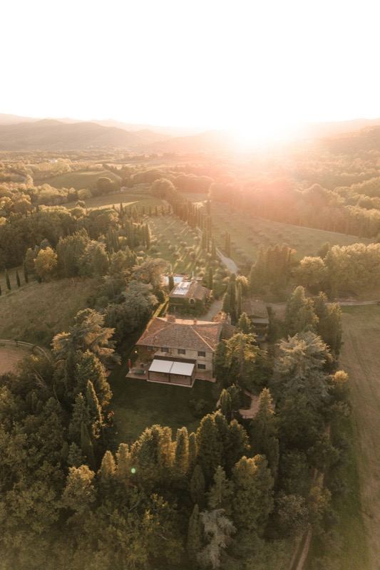 The estate from above at sunset, among olive groves and hills