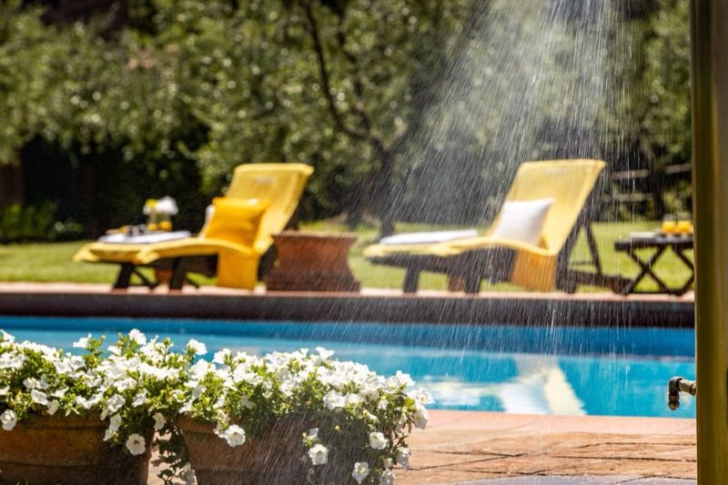 The rain shower beside the yellow loungers