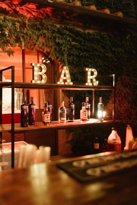 The lit bar corner under the ivy