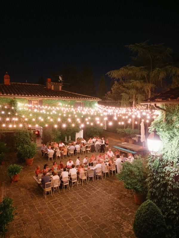 The lit courtyard with the long table seen from above