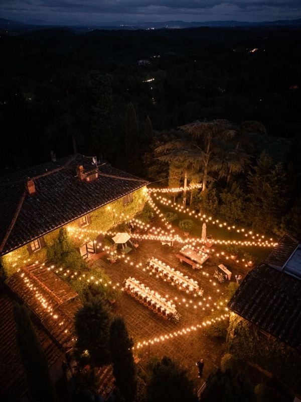 The courtyard dinner under the lights, at night from above