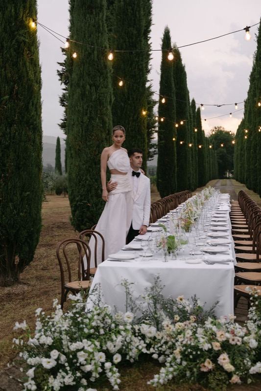 The couple at the long table in the cypress avenue